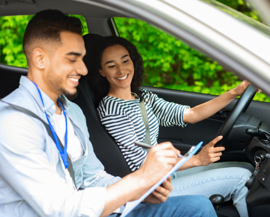 driving school instructor in vehicle with student