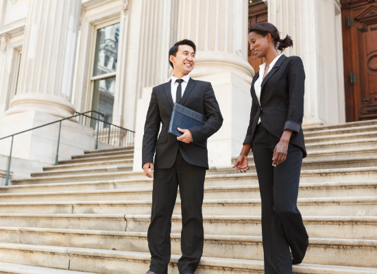 man and woman smiling on court steps