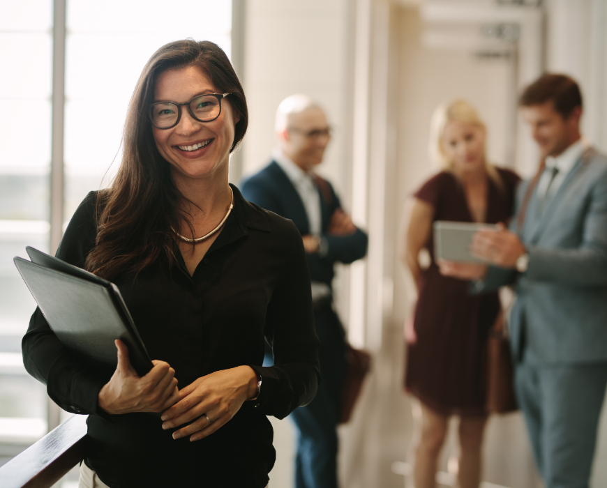 woman standing in front of colleagues