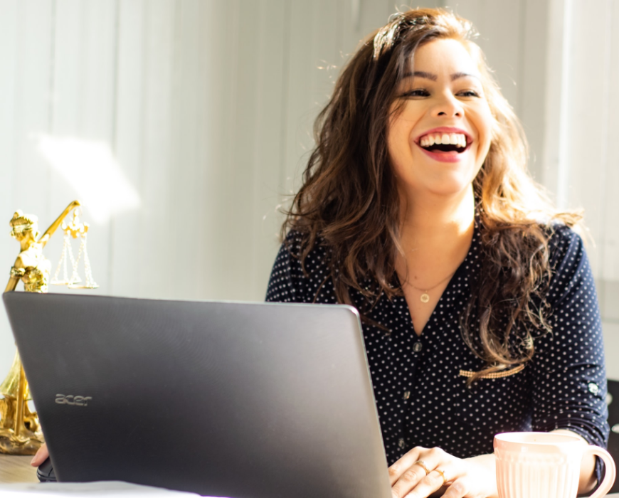 smiling woman at desk