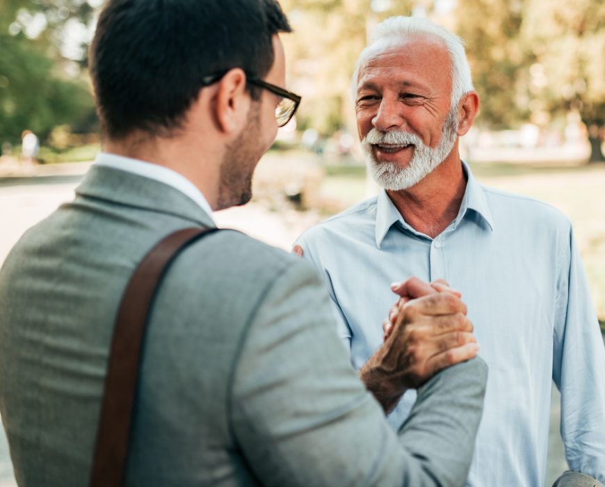 two gentlemen shaking hands outside two gentlemen shaking hands outside