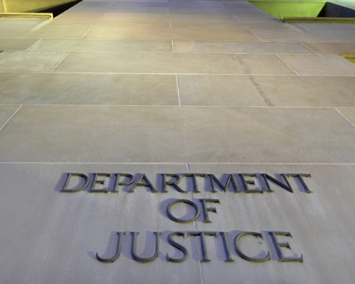 Department of Justice text on ground Department of Justice text on ground